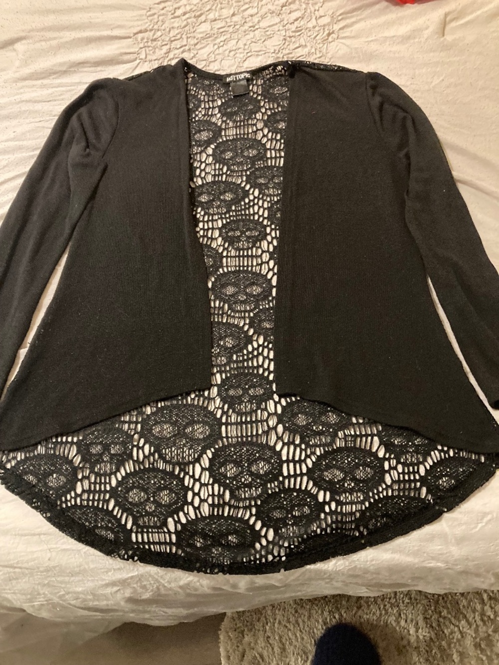 Used hot topic sweater lace back with skulls